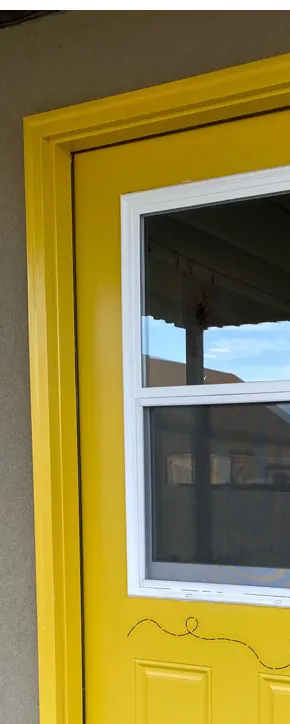 A bright yellow door with a painted bee, the preschool’s own entrance