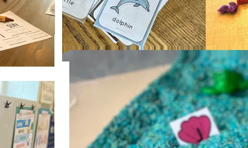 A sensory bin of blue rice with toy sea animals and paper shells